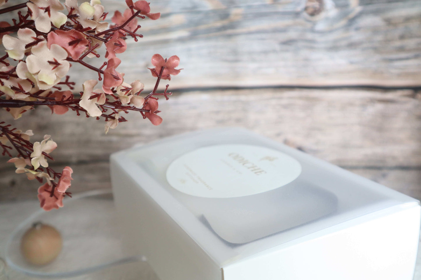 Limited-edition Mother's Day gift set in a white box with floral accents, showcasing luxury scented candles.