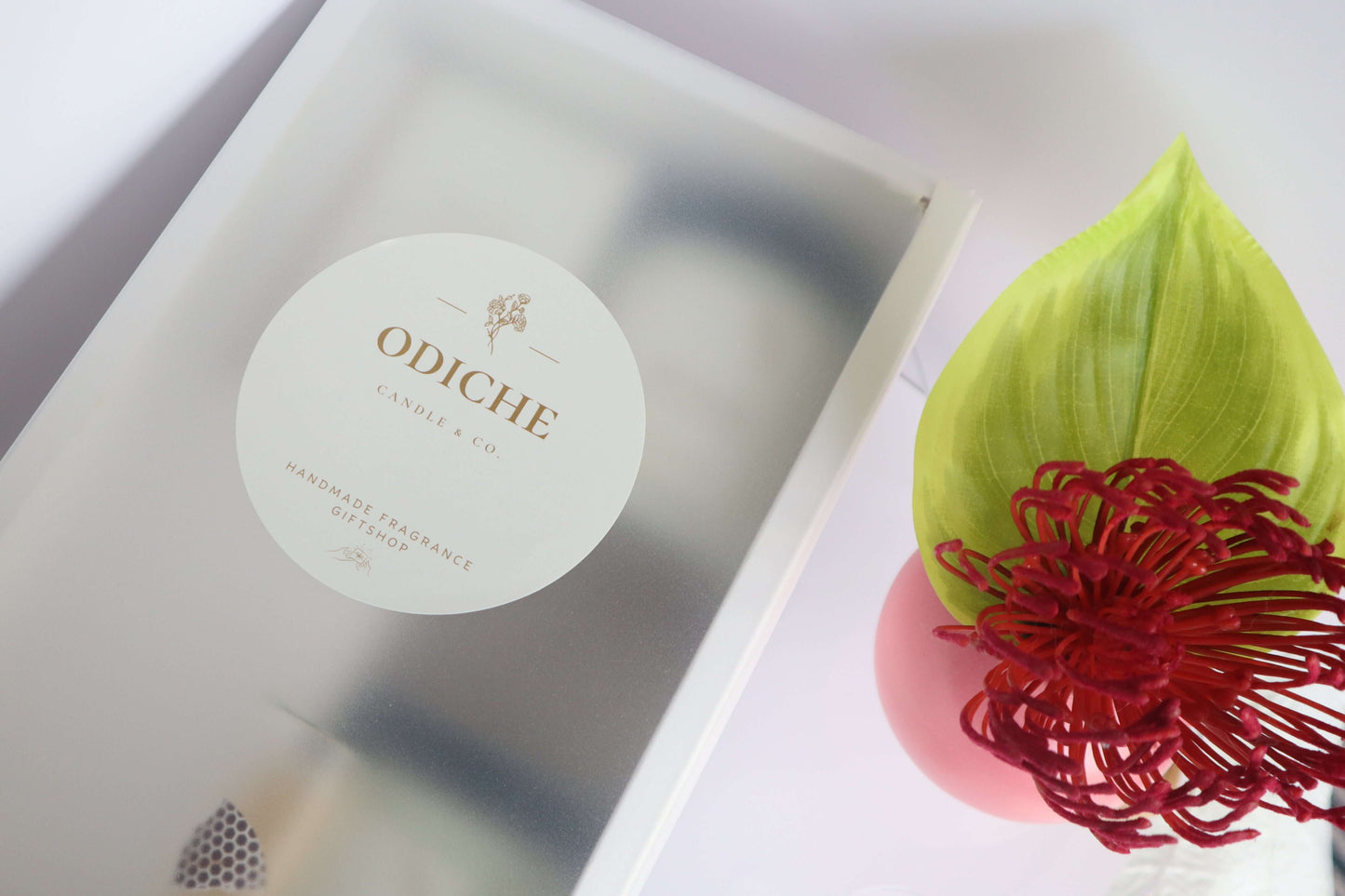 Luxury candle packaging with a white label on an elegant gift box, featuring eco-friendly design.