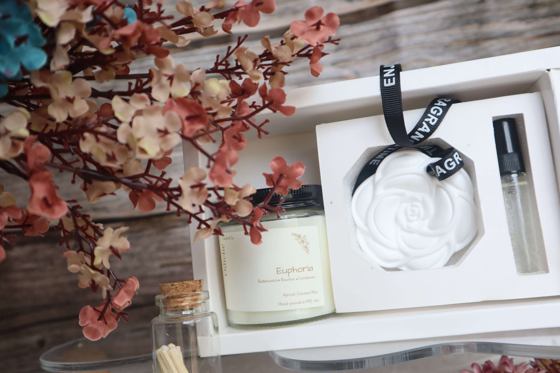 Luxurious Mother's Day gift set featuring hand-poured soy candle, elegant rose car diffuser, and matchsticks.