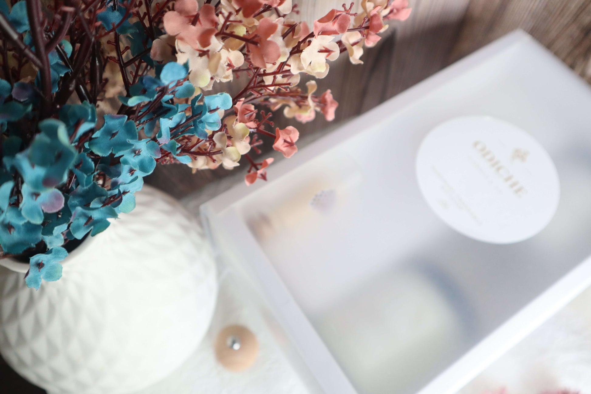 Stylish gift set featuring hand-poured soy candles and a decorative vase with colorful dried flowers.