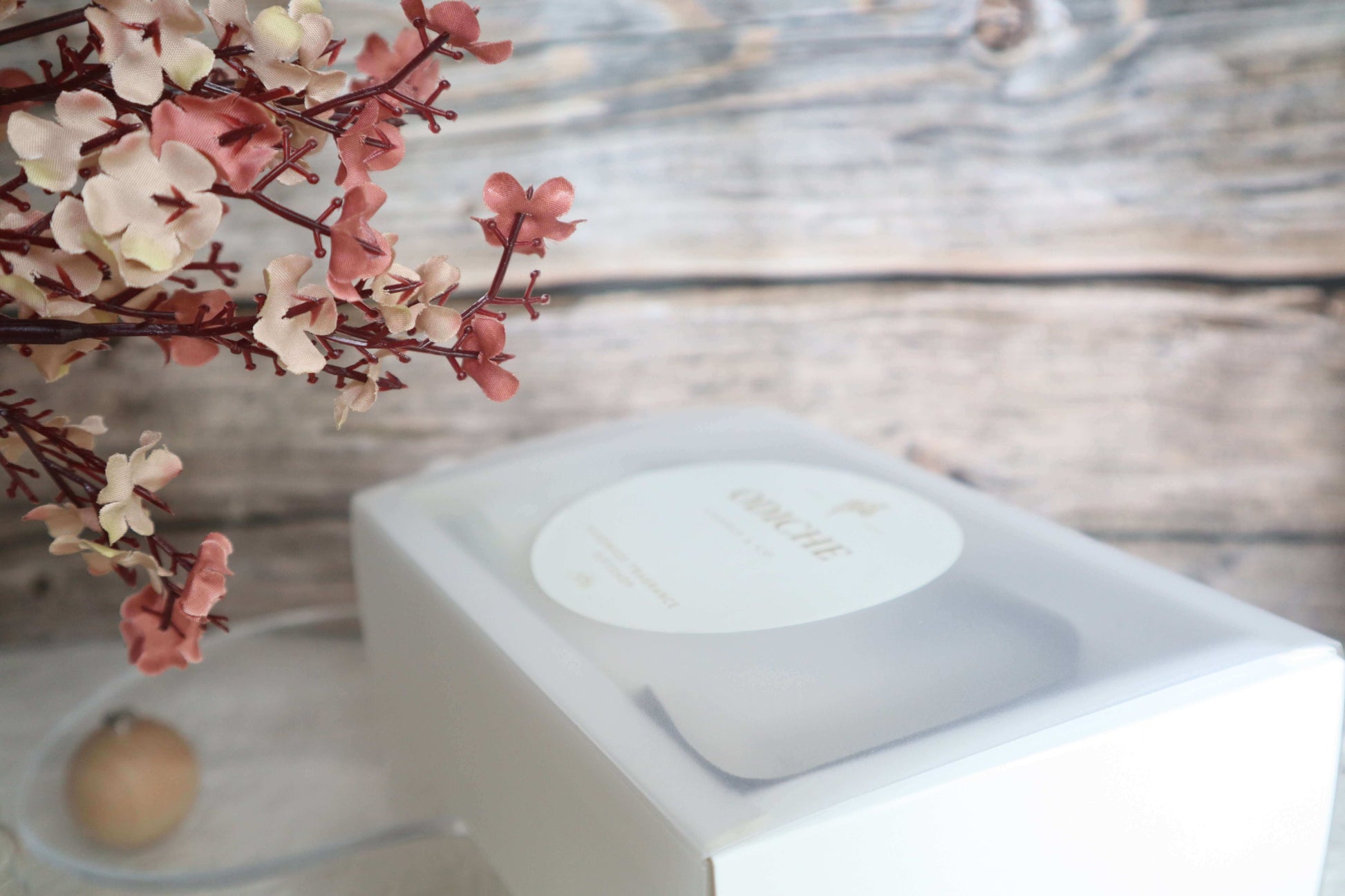 Limited-edition Mother's Day gift set in a white box with floral accents, showcasing luxury scented candles.