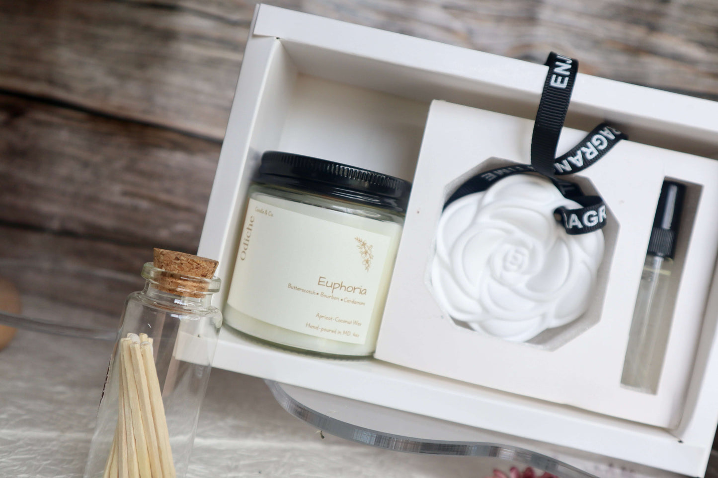 Luxury self-care gift set featuring hand-poured soy candle, elegant rose diffuser, and matchsticks in a beautiful box.